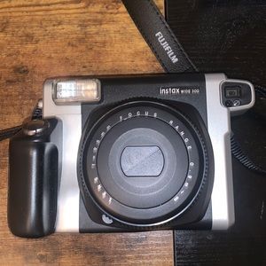 I am selling a Instax Wide 300 camera. It already has a pack of films in it.